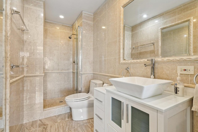 bathroom with a stall shower, tasteful backsplash, toilet, vanity, and tile walls