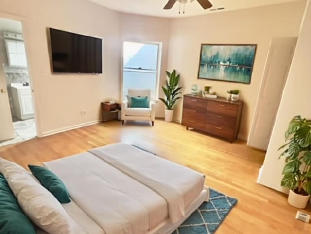 6945 S Dorchester Ave Unit 2S, Chicago, IL 60637 - living area featuring a ceiling fan and light wood-style floors
