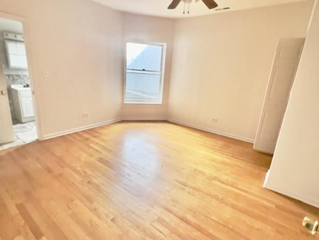 6945 S Dorchester Ave Unit 2S, Chicago, IL 60637 - empty room featuring a ceiling fan, light wood finished floors, and baseboards