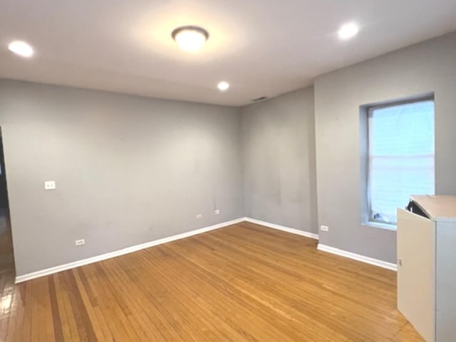 spare room with light wood-type flooring