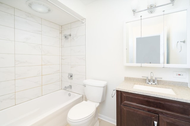 full bathroom with toilet, vanity, and tiled shower / bath