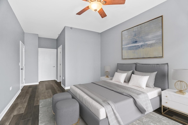 bedroom featuring ceiling fan and dark hardwood / wood-style floors