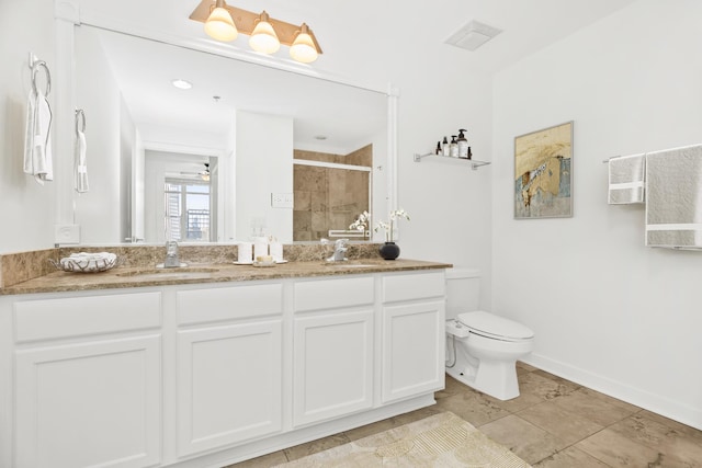 bathroom featuring toilet, vanity, ceiling fan, and walk in shower