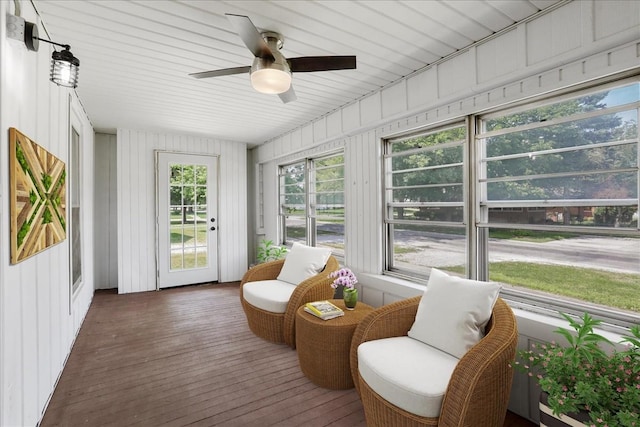 sunroom / solarium featuring ceiling fan