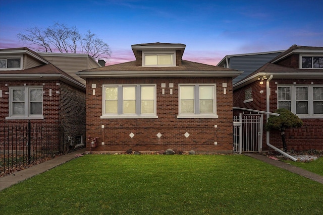 view of front of home featuring a yard