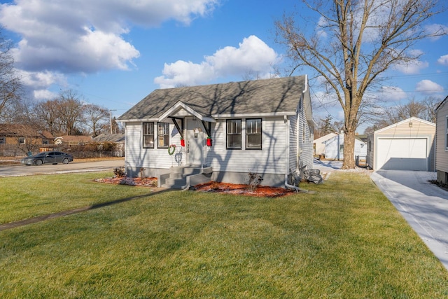 bungalow-style house with a garage, a front lawn, and an outdoor structure