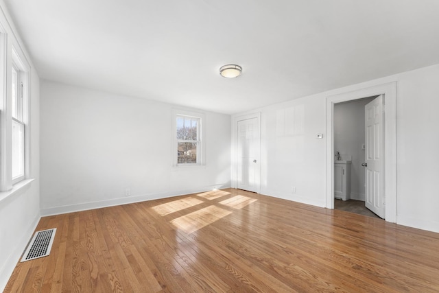 empty room featuring hardwood / wood-style flooring