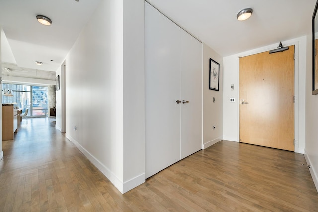 hallway featuring light wood-type flooring