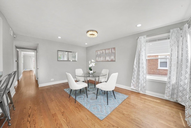 dining area featuring light wood-type flooring