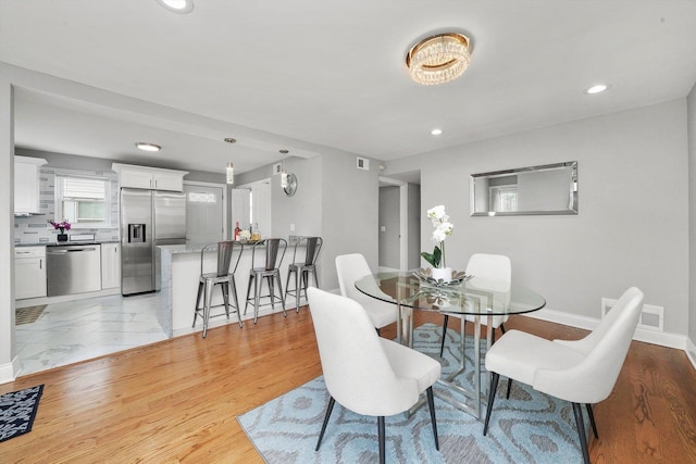 dining room featuring light wood-type flooring