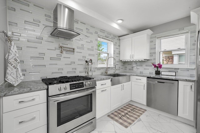 kitchen with stone counters, sink, ventilation hood, white cabinets, and appliances with stainless steel finishes