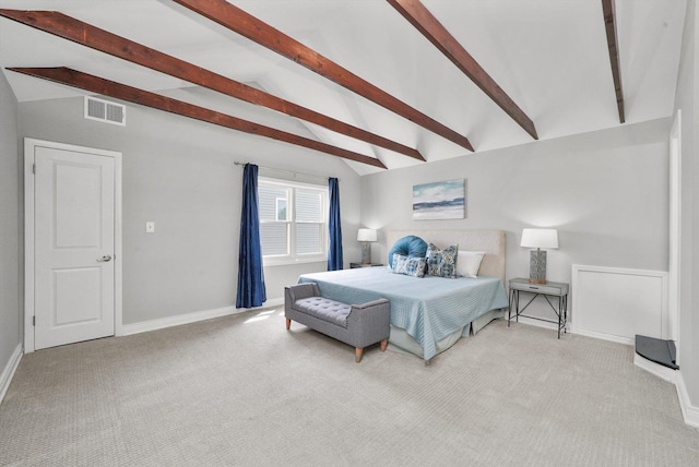 bedroom featuring lofted ceiling with beams and light colored carpet