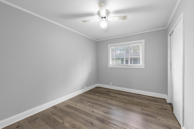 unfurnished bedroom featuring ceiling fan, dark hardwood / wood-style flooring, and ornamental molding