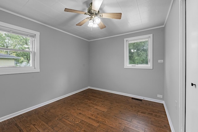 unfurnished room with dark hardwood / wood-style floors, ceiling fan, and crown molding