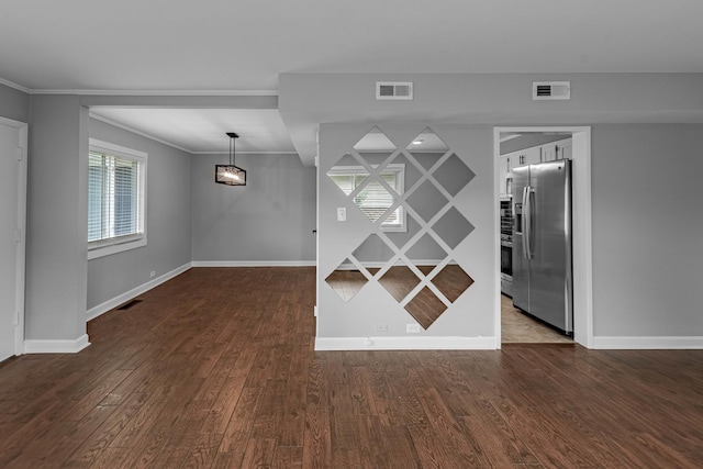 unfurnished room featuring dark hardwood / wood-style floors and ornamental molding