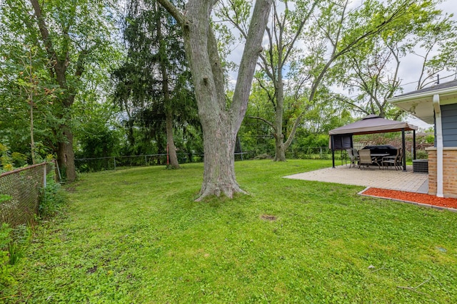 view of yard with a gazebo and a patio