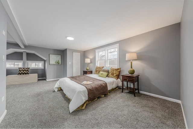 carpeted bedroom featuring lofted ceiling