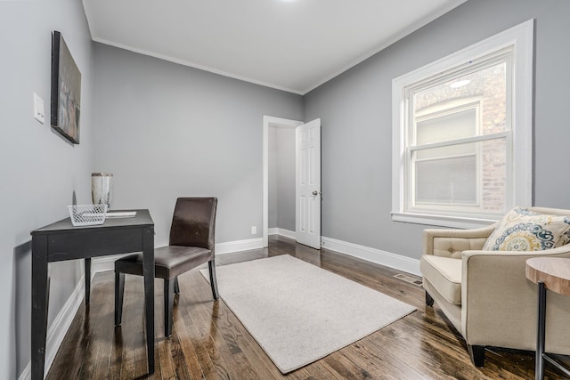 home office with ornamental molding and dark wood-type flooring