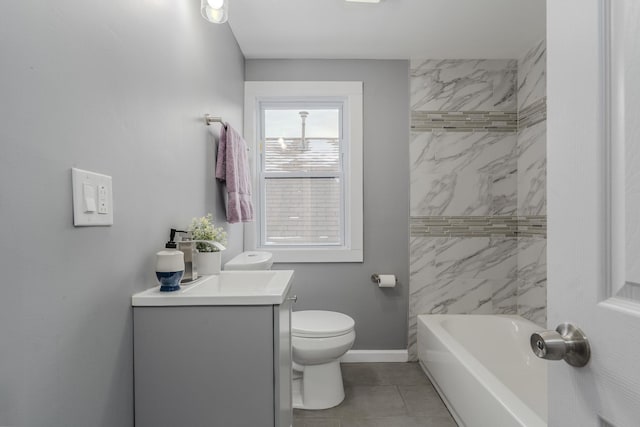 full bathroom featuring tile patterned floors, vanity, tiled shower / bath combo, and toilet