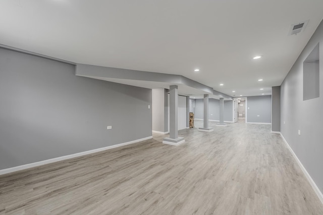 basement featuring light hardwood / wood-style floors