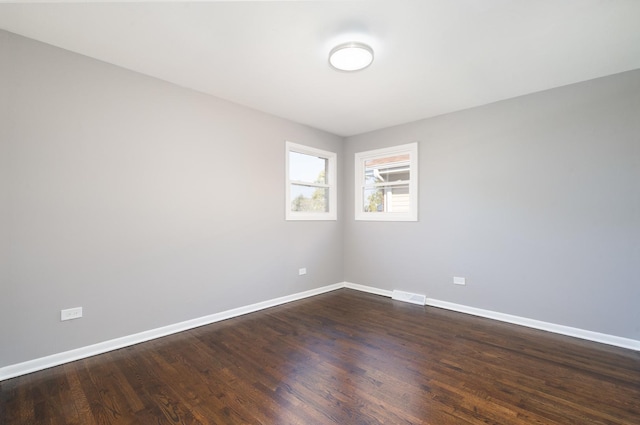 empty room featuring dark hardwood / wood-style floors