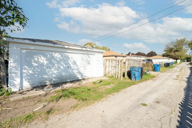 view of side of property with a garage and an outdoor structure