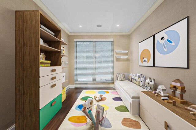 recreation room featuring ornamental molding and dark hardwood / wood-style floors