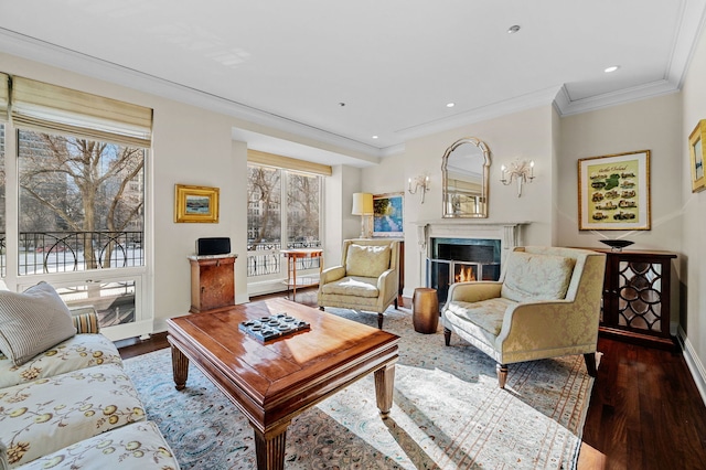 living room with dark hardwood / wood-style flooring, ornamental molding, and plenty of natural light