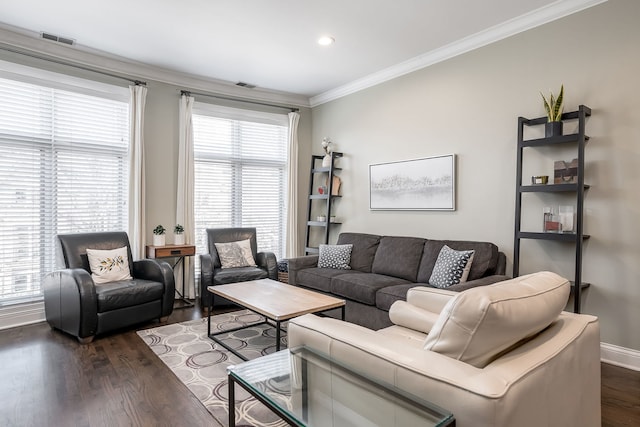 living room with dark wood-type flooring and ornamental molding