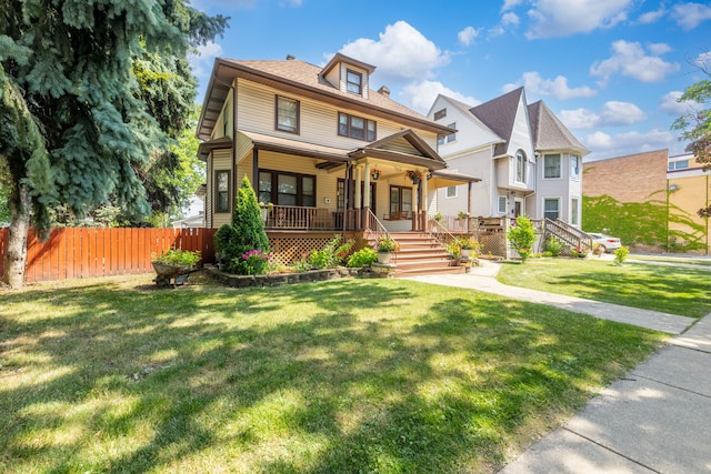 view of front of house featuring a front yard and covered porch