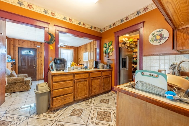 kitchen with ceiling fan, stainless steel fridge, and light tile patterned floors