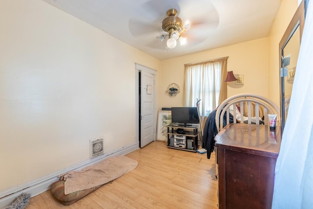 office featuring ceiling fan and light hardwood / wood-style flooring