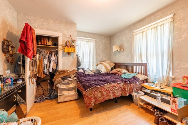 bedroom featuring a closet and light hardwood / wood-style flooring