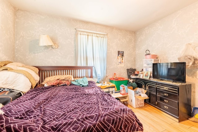 bedroom with light wood-type flooring