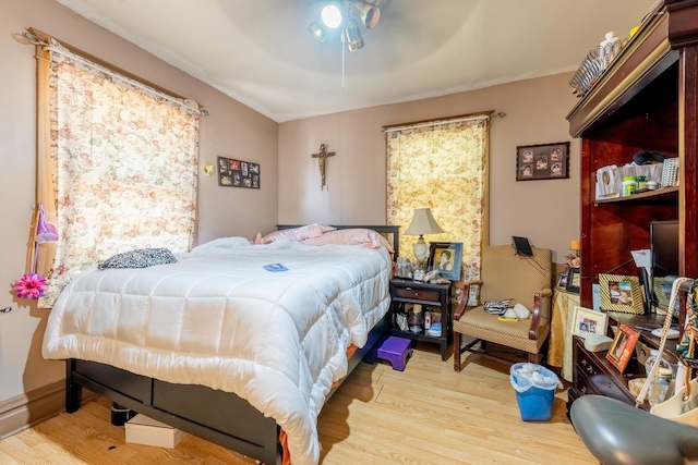 bedroom featuring ceiling fan and light hardwood / wood-style flooring