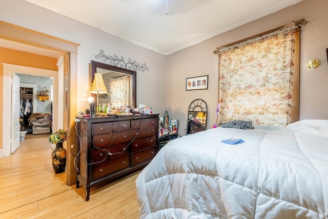 bedroom with hardwood / wood-style floors