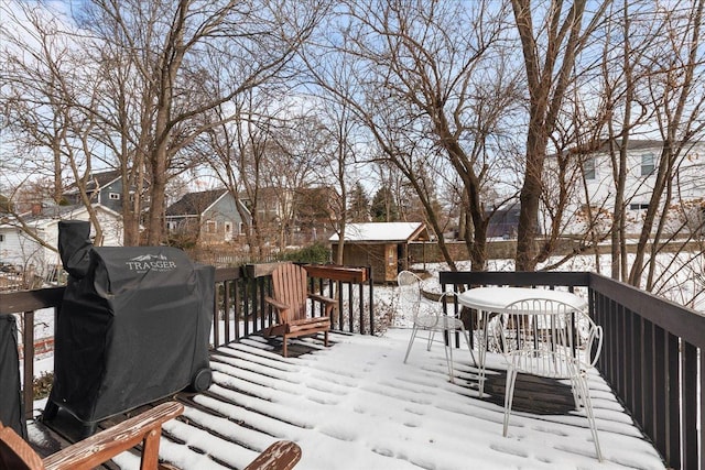 snow covered deck with grilling area