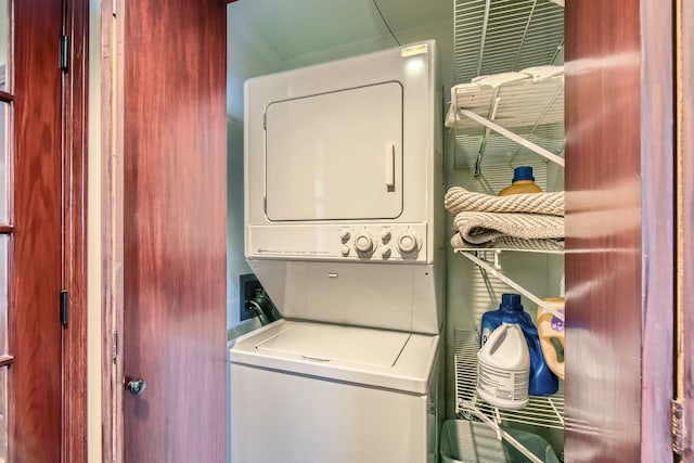 laundry room with stacked washer and dryer