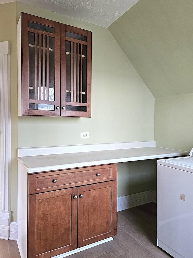 clothes washing area featuring washer / dryer and a textured ceiling