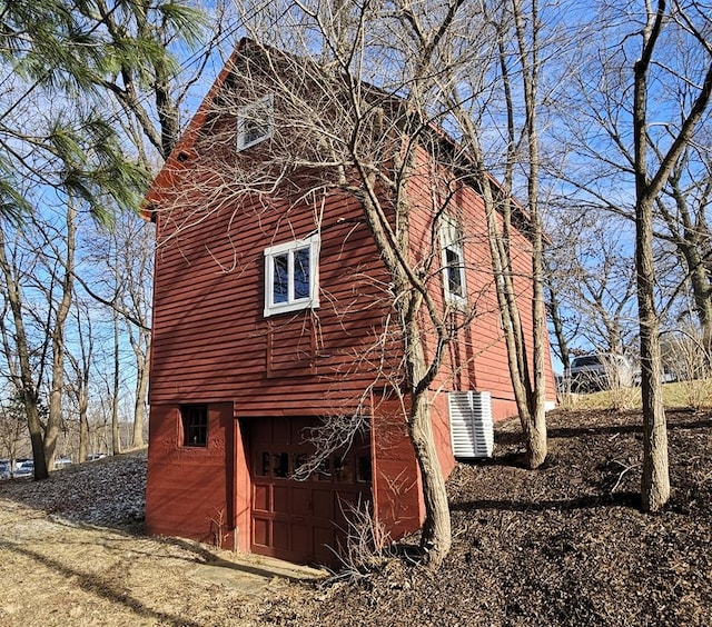 view of side of home with a garage