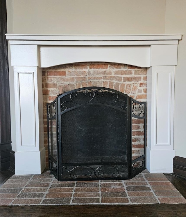 details with a brick fireplace