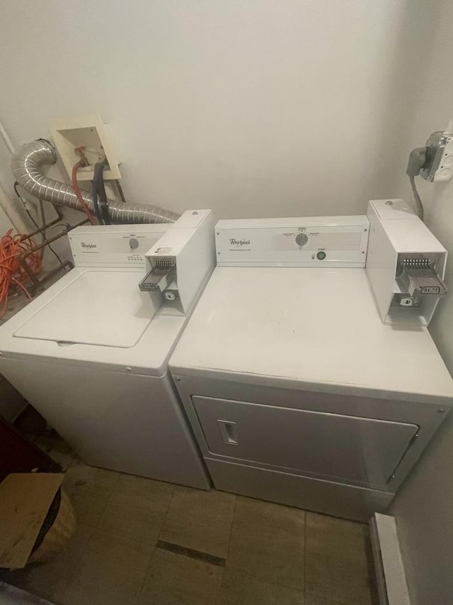 laundry area with tile patterned flooring, laundry area, and independent washer and dryer