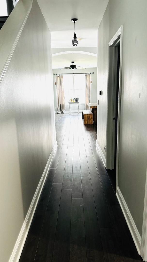 hall featuring dark wood-type flooring