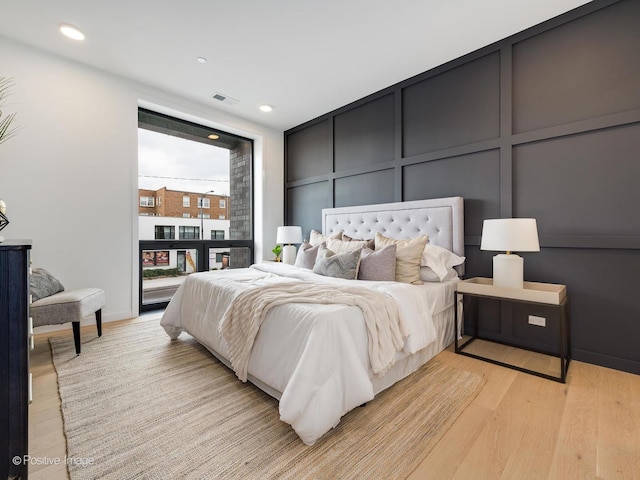 bedroom with light hardwood / wood-style flooring