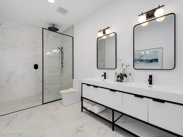 bathroom featuring a tile shower, vanity, and toilet