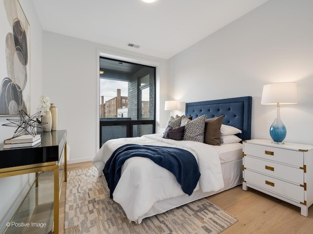 bedroom featuring light wood-type flooring