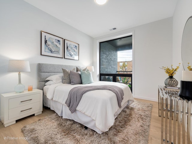 bedroom with light wood-type flooring