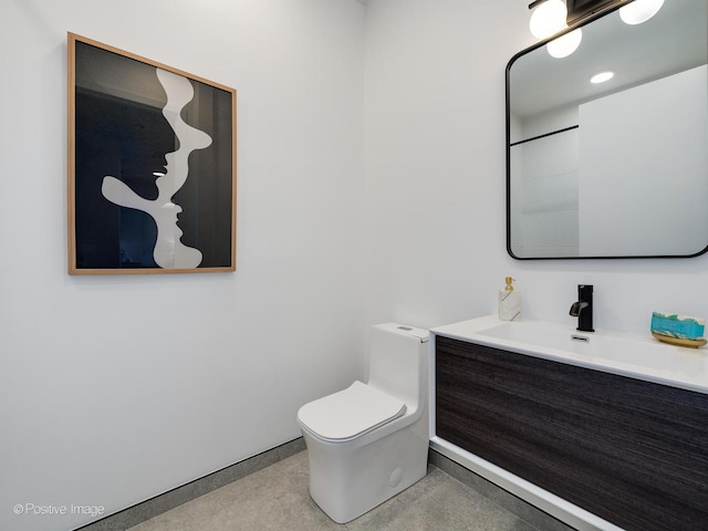 bathroom with vanity and toilet