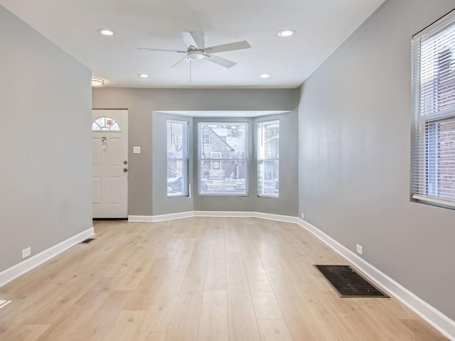 entrance foyer featuring ceiling fan and light wood-type flooring