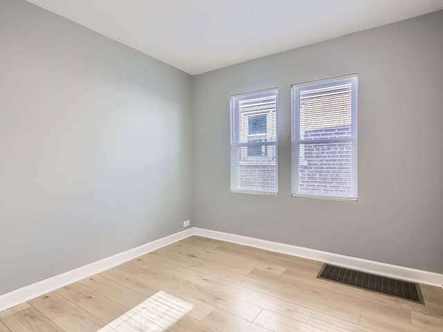 spare room with light hardwood / wood-style floors